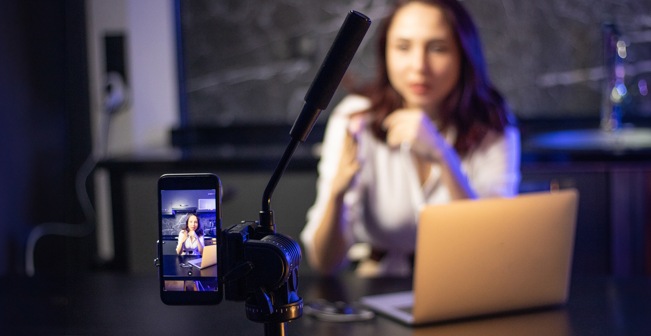 photo of person self recording with a smartphone